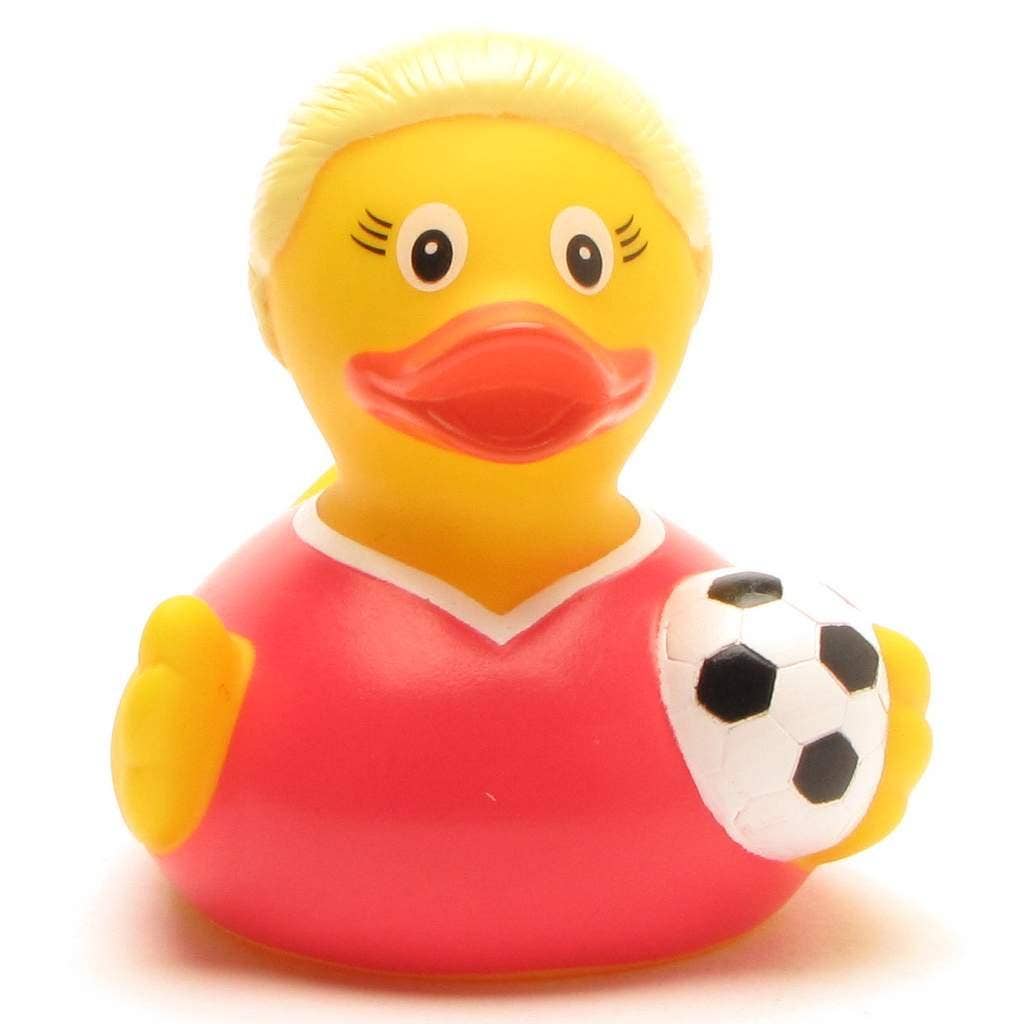 Pato de goma jugadora de fútbol sosteniendo un balón blanco y negro