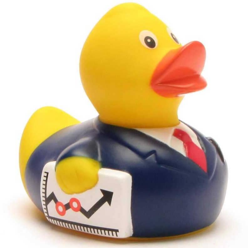 Pato de goma hombre de negocios con traje azul, corbata roja y maletín