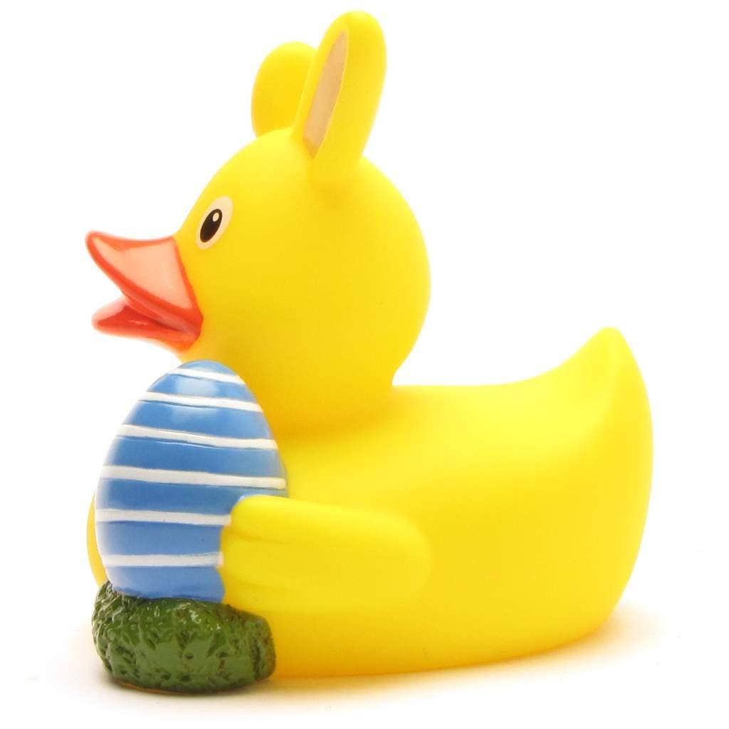 Vista lateral izquierdo de pato de goma de Pascua con huevo azul y orejas de conejo