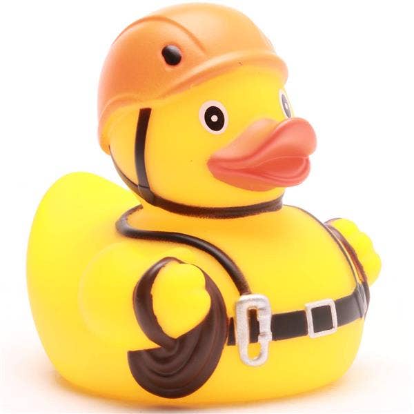 Pato de goma alpinista con casco y equipo de escalada