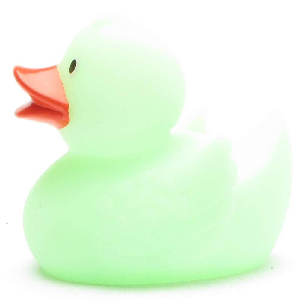 Pato de goma verde brillante en la oscuridad