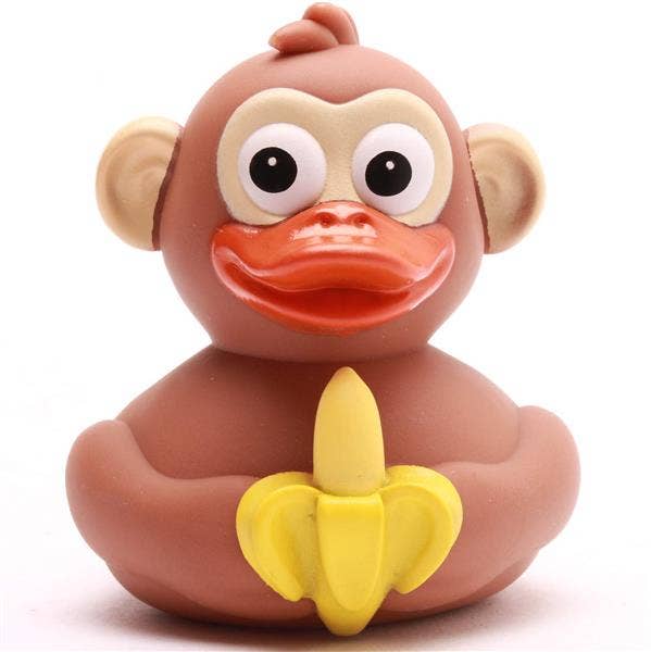 Pato de goma mono sosteniendo un plátano