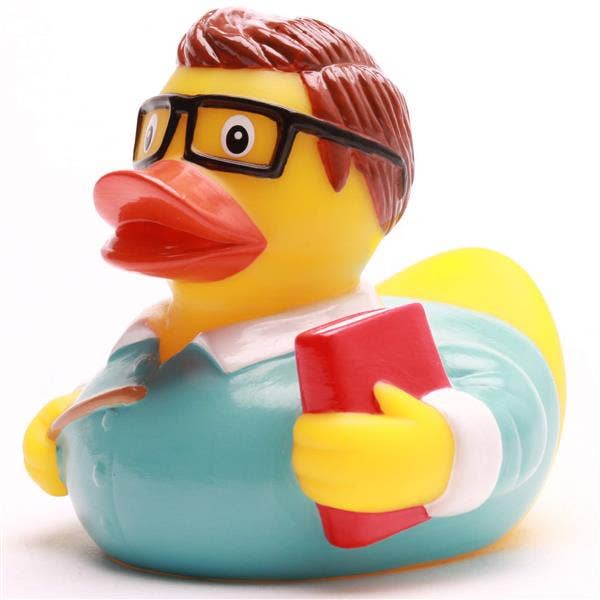 Detalle pato de goma profesor con gafas y libro